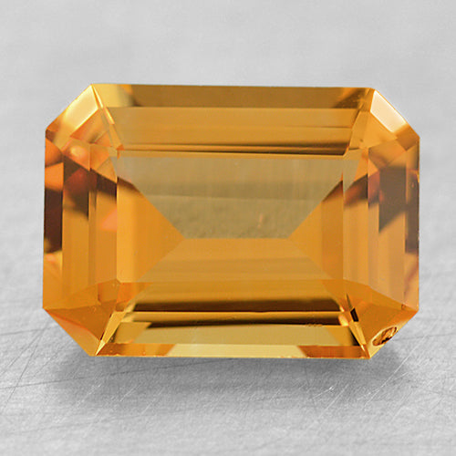 Loose Medium Yellowish-Orange Emerald Cut Sapphire